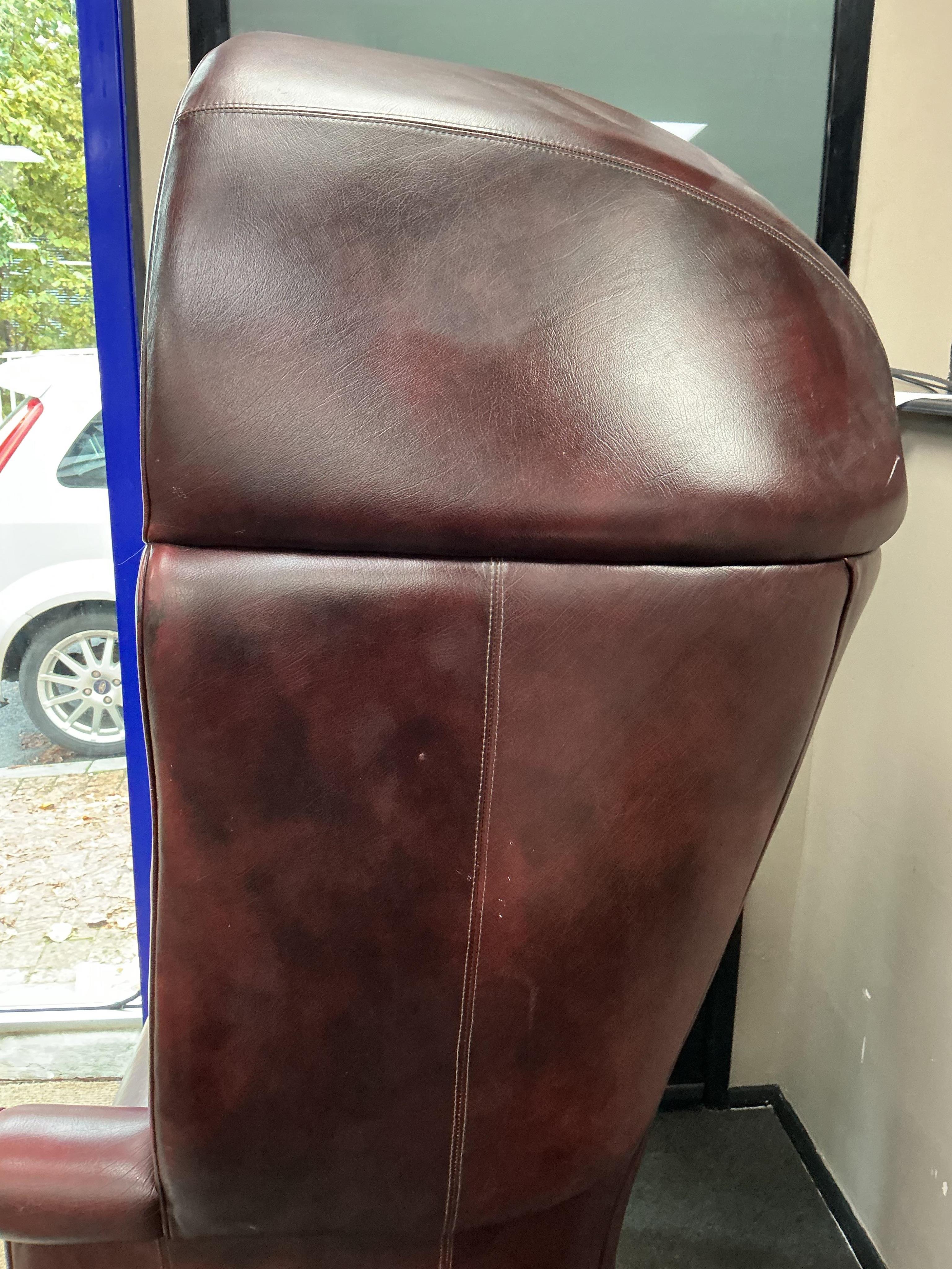 A reproduction buttoned burgundy leather hall porter's chair, width 88cm, depth 64cm, height 176cm